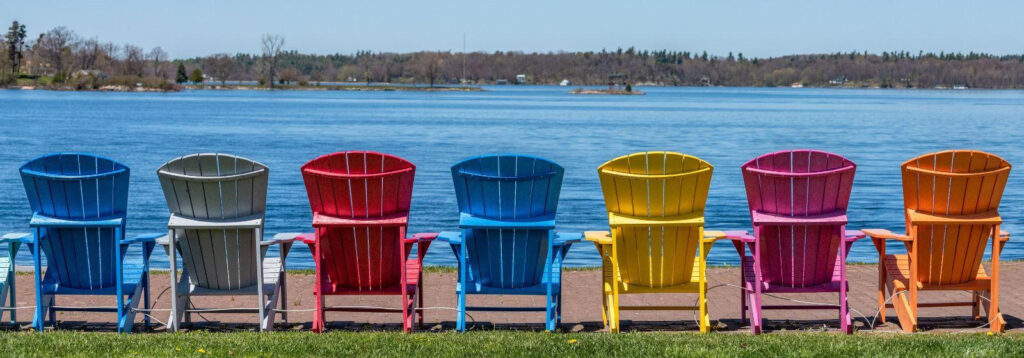 Adirondack chairs in front of St. Lawrence River in Clayton, NY